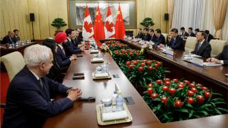 Prime Minister Trudeau and Cabinet ministers sit across from President Xi Jinping and Chinese ministers during meeting