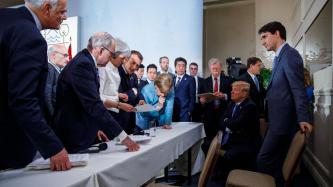 The G7 Leaders discuss concerning the G7 Summit Communiqué.