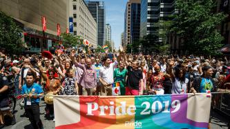 PM Trudeau waves to crowd in the Toronto Pride Parade