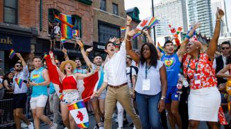 PM Trudeau waves to crowd in the Toronto Pride Parade