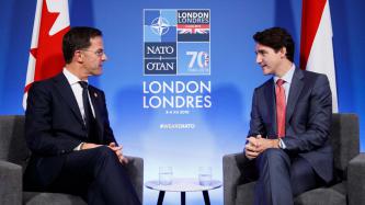 PM Justin Trudeau sits with the PM of the Netherlands, Mark Rutte