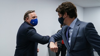 PM Trudeau greets PM Legault with an elbow bump