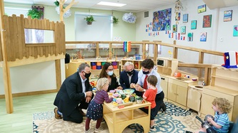 PM Trudeau plays with children at a table