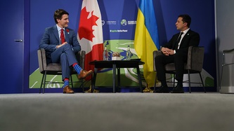 President Volodymyr Zelenskyy and Prime Minister Justin Trudeau sit and look to one another