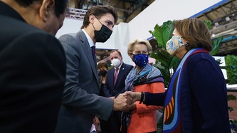 Prime Minister Justin Trudeau exchanges a handshake with a woman