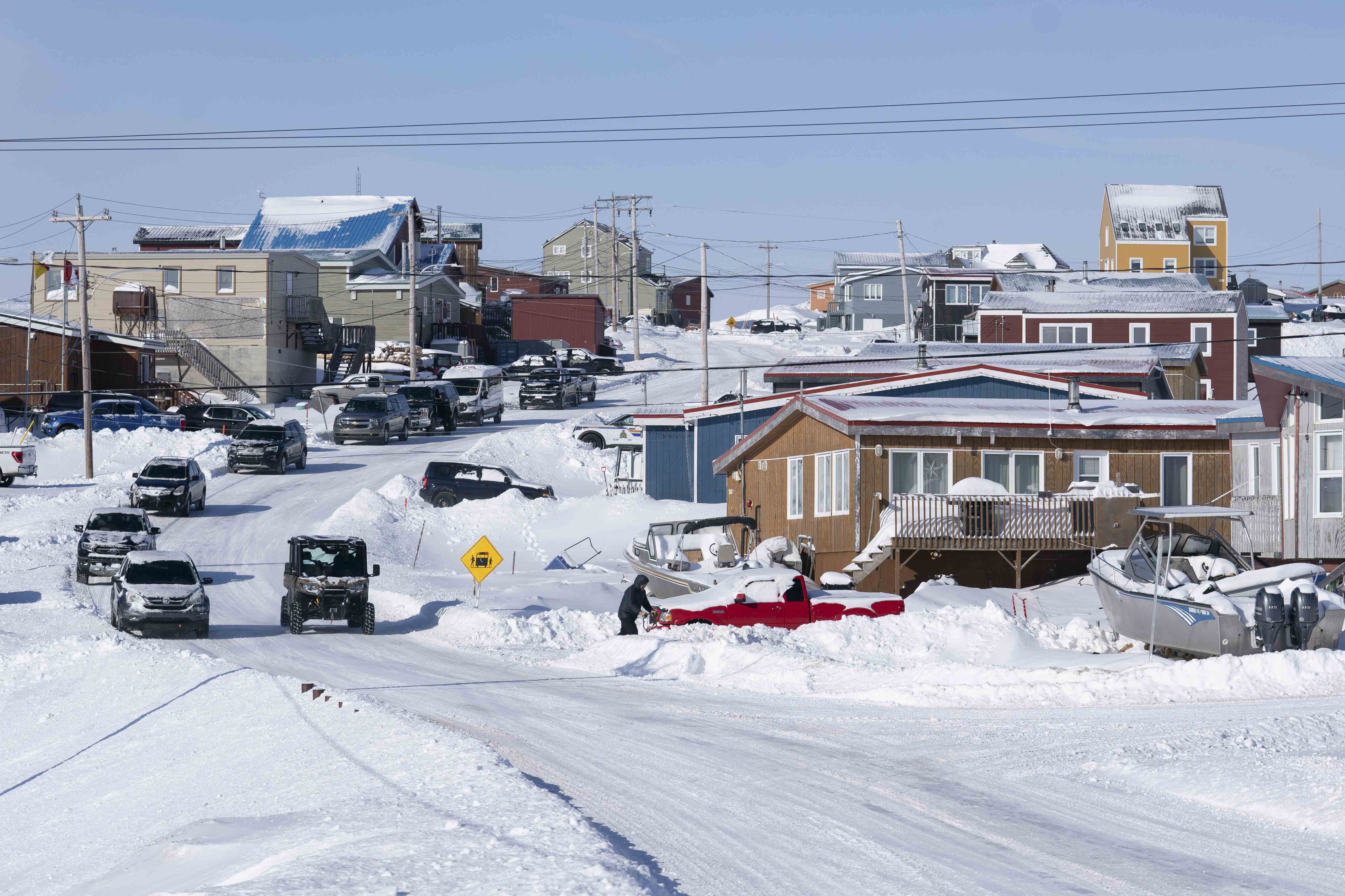 View of residential homes and streets in Iqaluit during winter.