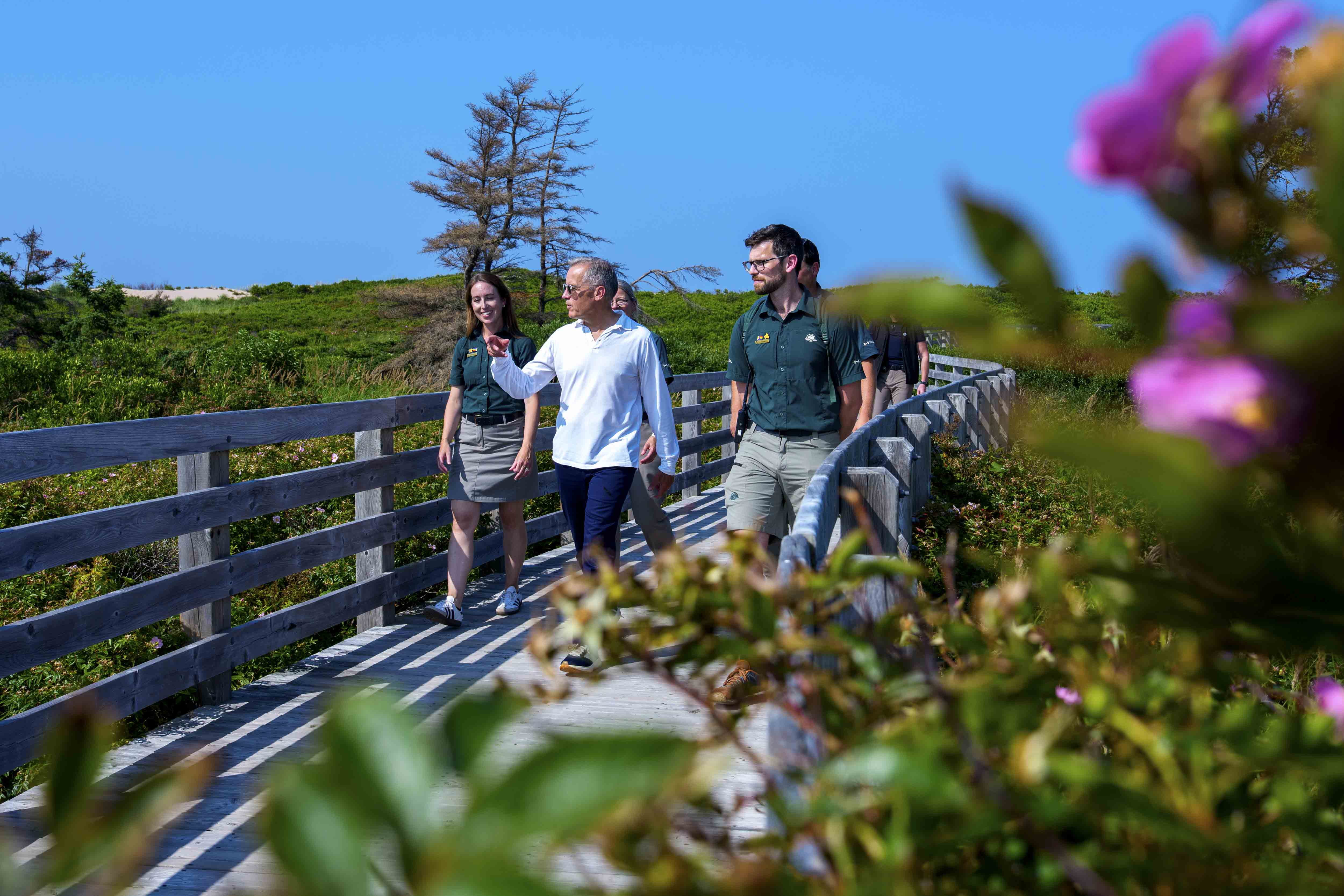 Prime Minister Mark Carney visits Prince Edward Island National Park and walks with Parks Canada employees.