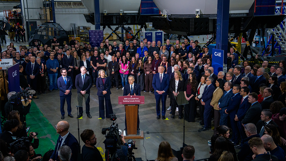 Prime Minister Mark Carney stands at a podium to announce Canada’s Defence Industrial Strategy.