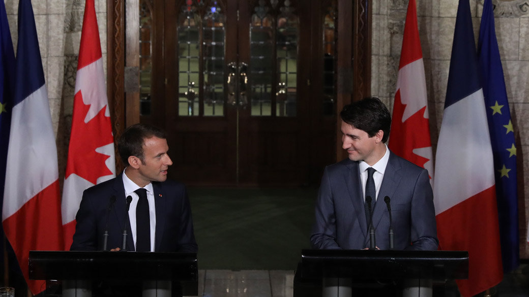 Prime Minister Trudeau and President Macron stand at podiums