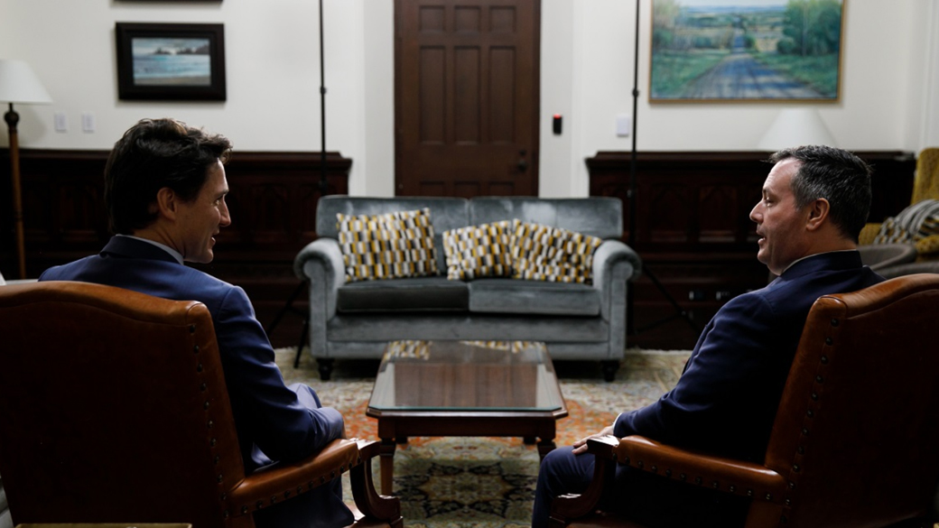 Prime Minister Trudeau sits with Alberta Premier Kenney