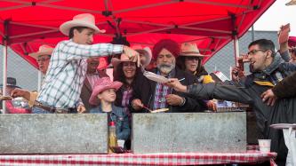 Photo number 1 from the photo gallery Prime Minister Justin Trudeau attends the Genesis Centre Stampede Breakfast in Calgary, Alberta