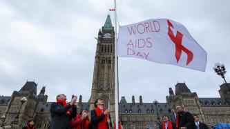 Photo number 1 from the photo gallery Prime Minister Justin Trudeau helps to raise the World AIDS Day flag on Parliament Hill