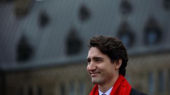 Photo number 2 from the photo gallery Prime Minister Justin Trudeau helps to raise the World AIDS Day flag on Parliament Hill