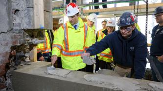Photo number 1 from the photo gallery Prime Minister Justin Trudeau places the last stone during the restoration of West Block on Parliament Hill