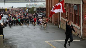 Photo number 1 from the photo gallery Prime Minister Justin Trudeau and Minister Harjit Sajjan run with members of the Canadian Forces stationed at CFB Esquimalt