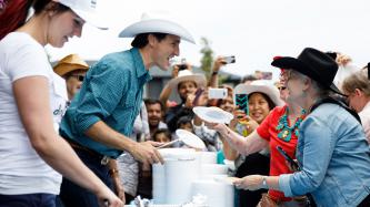 Photo number 3 from the photo gallery Prime Minister Trudeau meets Justin-Trudeau Adam Bilal, the son of newly arrived Syrian refugees, during a pancake breakfast in Calgary