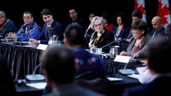 Nisg̱a’a Nation President Eva Clayton speaks during the forum while Prime Minister Justin Trudeau, Minister Carolyn Bennett and other ministers and officials look on