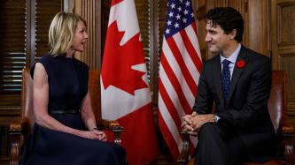 Prime Minister Justin Trudeau listens to United States Ambassador to Canada, Kelly Craft, speak during a meeting in his office