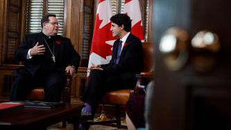 Prime Minister Justin Trudeau sits and talks with His Eminence Cardinal Gérald C. Lacroix, Archbishop of Quebec in his office