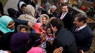 Prime Minister Justin Trudeau speaks to young children from the community