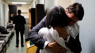 Prime Minister Trudeau consoles Tony Obed with a hug after their private meeting