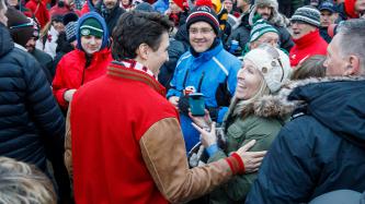 Prime Minister Justin Trudeau meets with fans before the Grey Cup