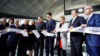 Prime Minister Justin Trudeau, Premier Kathleen Wynne, Mayor John Tory and others cut the ribbon at the official opening