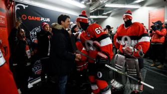 Prime Minister Justin Trudeau shakes hands with Ottawa Senators captain Erik Karlsson