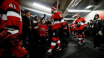 Prime Minister Justin Trudeau and his son Xavier greet the Ottawa Senators