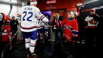 Xavier Trudeau greets Montreal Canadiens' defenseman Karl Alzner