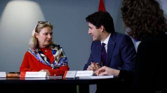 Prime Minister Justin Trudeau talks with councillor Giuliana Fumagalli