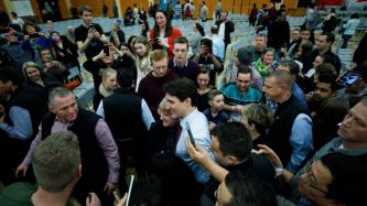 Prime Minister Justin Trudeau poses for photographs with crowd members
