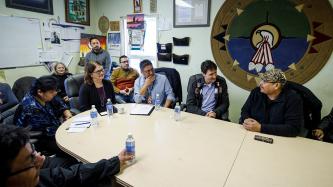 Prime Minister Justin Trudeau and Minister Jane Philpott discuss with the Chief and the Council of Pikangikum First Nation during a meeting.