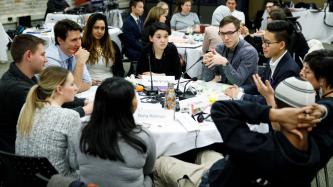 Prime Minister Justin Trudeau listens to a member of the Prime Minister's Youth Council during a roundtable discussion.