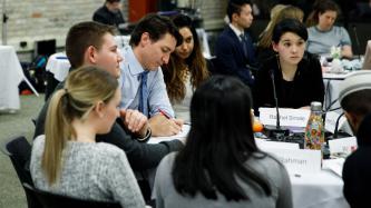 Prime Minister Justin Trudeau takes notes during a roundtable discussion with members of the Prime Minister's Youth Council.