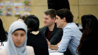 Prime Minister Justin Trudeau listens during a roundtable discussion with members of the Prime Minister's Youth Council.