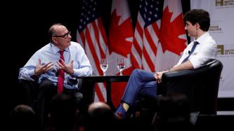 David Axelrod speaks to PM Trudeau during an armchair discussion
