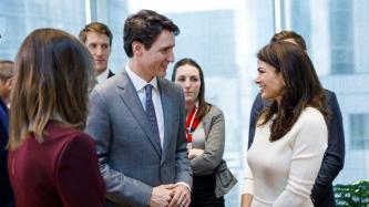 PM Trudeau speaks with a woman