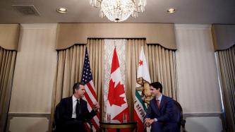 PM Trudeau listens to Lieutenant Governor Newsom speak