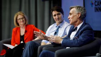 Bill Nye speaks while Prime Minister Justin Trudeau and MP Kate Young look on during an armchair discussion at the University of Ottawa  
