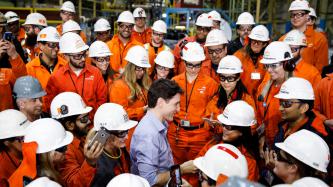 Prime Minister Justin Trudeau meets with workers at the ArcelorMittal Dofasco plant