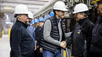 Prime Minister Justin Trudeau and MP Terry Sheehan shake hands with Algoma steel workers one-by-one upon entering the facility of the Direct Strip Production Complex