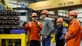 An EVRAZ employee gestures in conversation with Prime Minister Justin Trudeau and Minister Ralph Goodale at the company’s facility in Regina