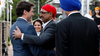 Prime Minister Justin Trudeau greets Minister Amarjeet Sohi at Gurdwara Millwoods in Edmonton