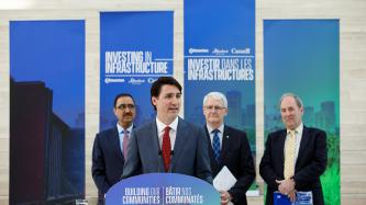 PM Trudeau addresses the crowd alongisde Minister Amarjeet Sohi and Minister Marc Garneau