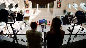 PM Trudeau addresses the crowd from a podium, viewed from above