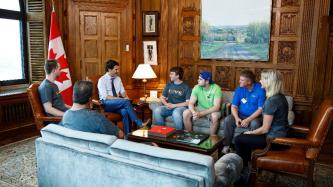 PM Trudeau meets with a group of people in his office