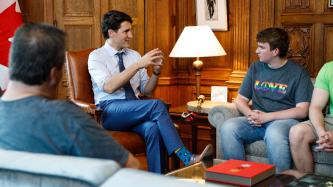 PM Trudeau meets with a group of people in his office