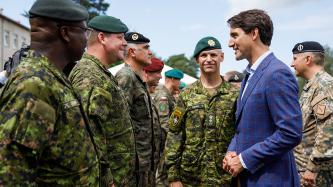 PM Trudeau talks with Canadian Soldier