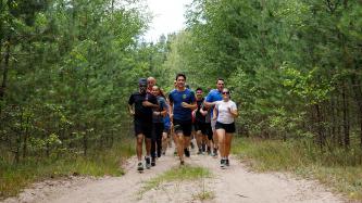 PM Trudeau and Ministers Freeland and Sajjan run with troops